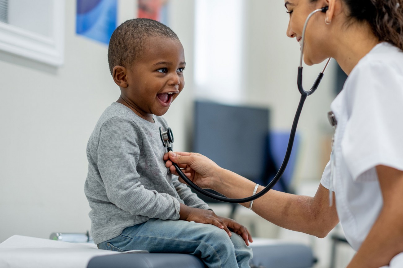 Doctor examining child