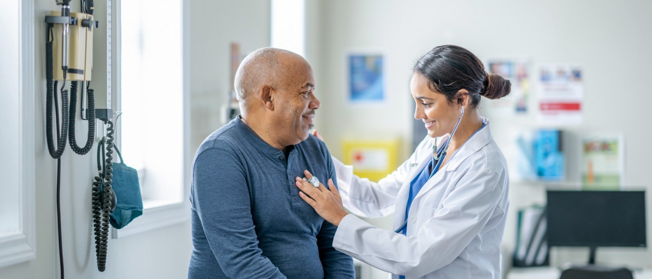 doctor with patient in examination room